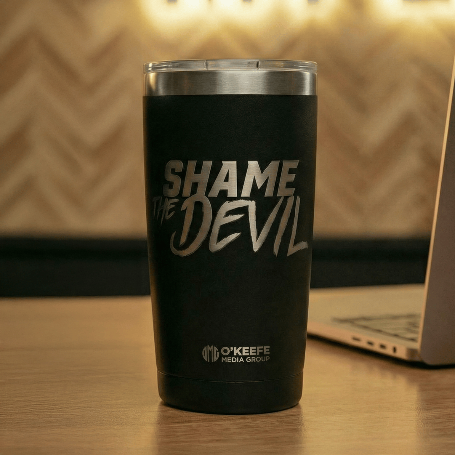 Black 20 oz stainless steel tumbler laser-engraved with "Shame the Devil" and the O&