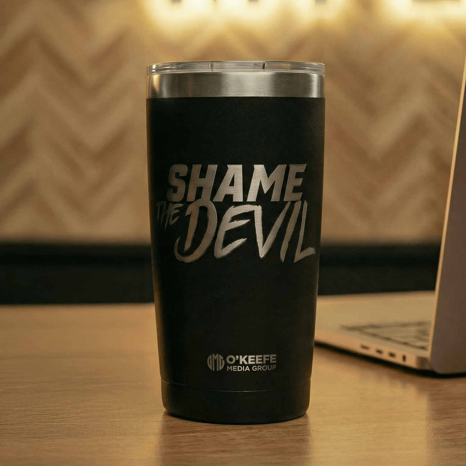 Black 20 oz stainless steel tumbler laser-engraved with "Shame the Devil" and the O&